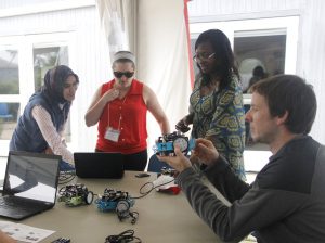 Teachers explore mBots and Finch robot.