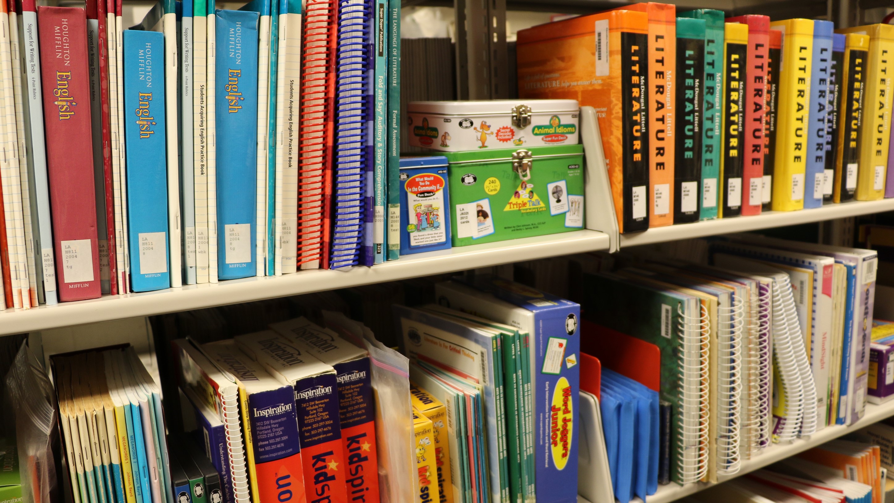 A row of books at the Educational Resource Center, including English and Literature guides.