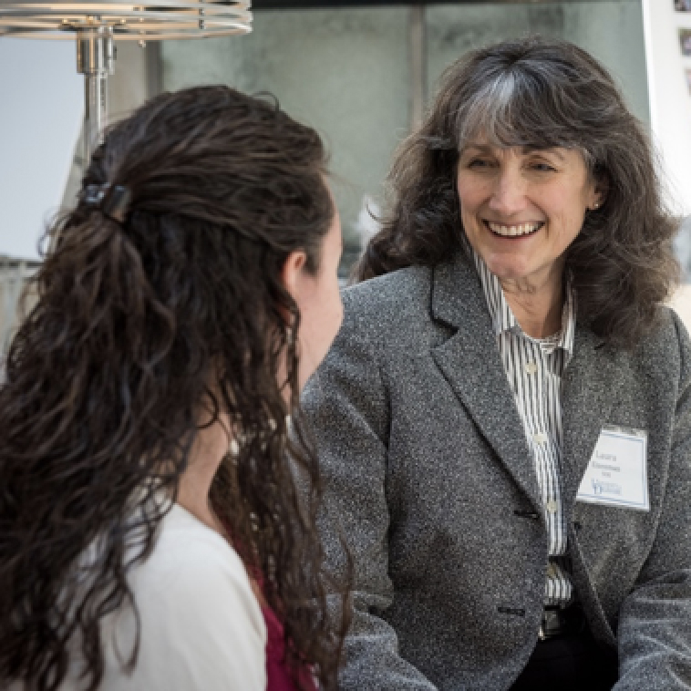 Doctoral student engages in research activity with teenager