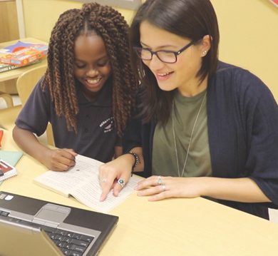 Teacher working with Student