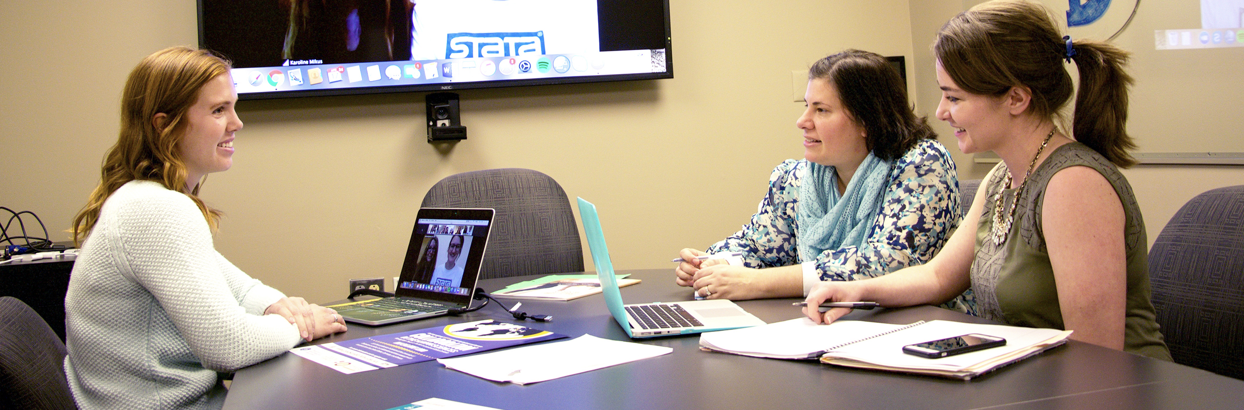 Three CEHD graduate students Skype with graduate students from another country