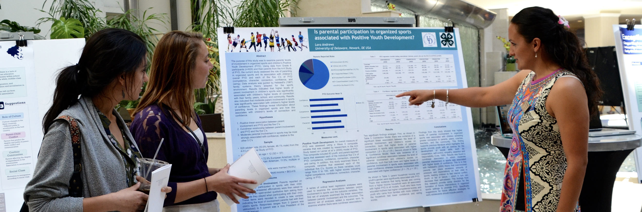 Student shows research poster at Steele Symposium