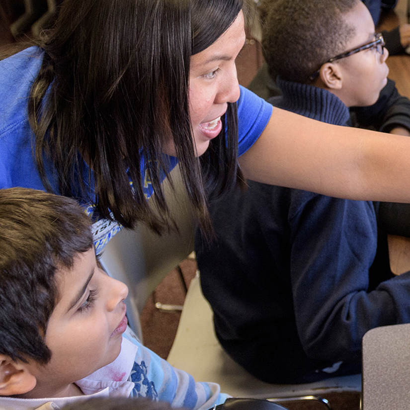 Teacher guides students through a lesson.