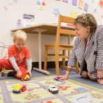 Roberta Michnick Golinkoff (right), Unidel H. Rodney Sharp Professor in the School of Education at the University of Delaware, meets with a child before his participation in learning experiments at the Child’s Play, Learning and Development Laboratory.