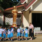 Allison Scott stands with her fourth grade students when she was teaching at a school in Trang, Thailand.