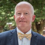 Portrait for Dean Gary Henry on the steps of Memorial Hall.