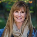 Head shot of Professor Nancy Jordan in an outdoor, wooded area.