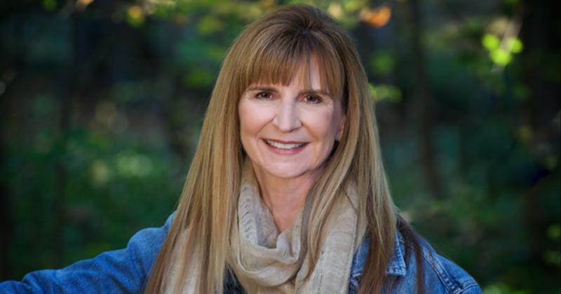 Head shot of Professor Nancy Jordan in an outdoor, wooded area.