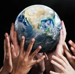 Hands holding up a globe