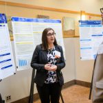 graduate student presents their research to faculty at steele symposium