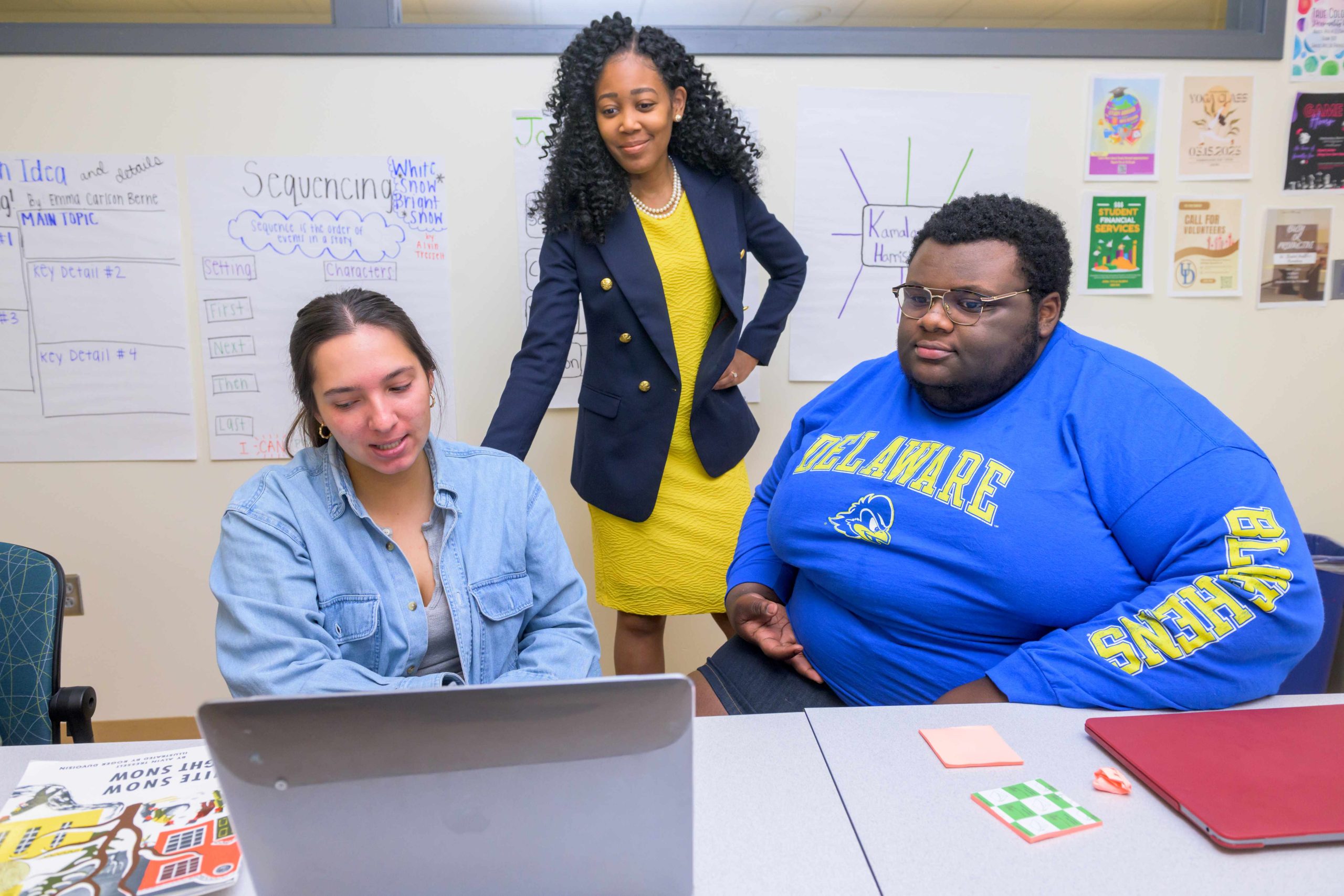 Doctoral student engages in research activity with two children